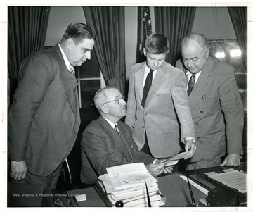 From left to right, Eugene A. Carter, President H. S. Truman, Unknown and Senator Sam Ervin.