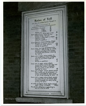 Shown here is a plaque showing the toll rates in front window at Searights Toll House.