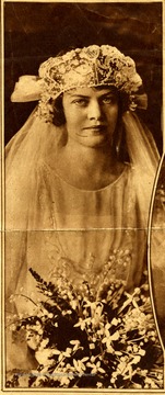 'Daughter of a former envoy to the Court of St. James's: Mrs. Wm. MacMillan Adams, formerly Miss Julia Davis, daughter of John W. Davis, the former Ambassador, a Mid-Autumn bride, who will live in Copenhagen, where her husband is engaged in business.'