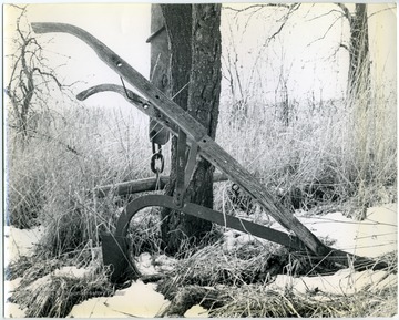 This was written on the back of the photo: "Day is Done, In a field by the side of a dirt road winding thru the South Western Pennsylvania hills, this plow has come to its final resting place. Having cultivated the soil and produced the food which nourished mankind while he searched for, and found, a better, faster and easier way to till the soil. It now passes into history. A noble instrument which added much to our journey into time. The picture was taken with a Retina Ib, having an Ektar f3.5 lense, on plus-X film, at 1/250 sec, and f16."