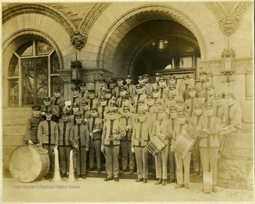 The library shown in the picture was later the Administration Building and now is called Stewart Hall. Director Walter Mestrezat is in the center with a baton in his hand.