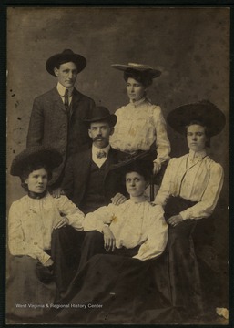 On the back of the photo: 'Man and Woman at top? Others left to right: Lou Hess Lumpert, James Andreus, Christy Gidley Reed, Florence Matthews and Mrs. Matthews. Mrs. Matthews worked at Morgantown Printing for many years.'