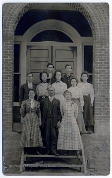 'Top row: Phillip E. Robinson and Guy Harner. Middle row: Earl L Wolfe, Rhey Harner, Bessie Robinson. Front row: Principal Gorman.'