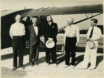 'First meeting to arrange for air transportation at new airport. Left to right: Elmer W. Prince(City Manger), Dr. L.S. Adams, Jennings Randolph(Congressman, J.M. Strouss(State Legislator), and John R. Fortney(Postmaster).'
