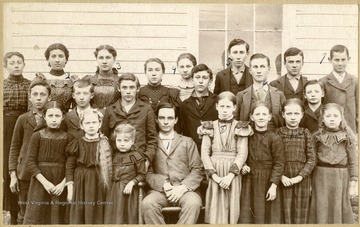 '1. Otto Ladwig (teacher) 2. Ella May Miley, 3. Hattie Cummins, 4. Merta Stout, 5. Clarence Nutter, 6. Clarence Stout, 4. French Stout, 8. Berta Nutter, 9. Mollie Stout, and Veda Davis (Langfitt) 