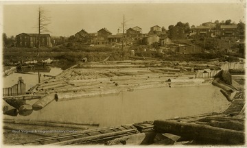 Postcard photograph of probably the Chaffey Mill pond, with the town of William in the background.