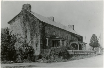 Information included with the photograph, "Built in early 1800's by Nathaniel Kuykendall, three miles west of Burlington in Mineral County. Served as headquarters of Colonel Claudius Crozet while constructing Northwestern Turnpike. The Tavern had "fifteen large rooms and ten immense fireplaces." 