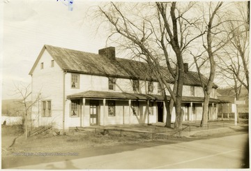 "Built by Eli Bell, 1784 in Hampshire county. Log house of twenty one rooms- used during Civil War - occupied by a detachment of Union soldiers - names of many may be seen today carved into wooden logs."