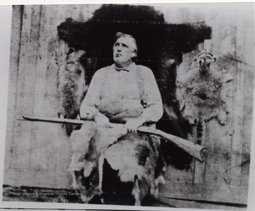 In the portrait, Dyer is holding animal skins and a gun. The town of Dyer in Webster County was named after him.