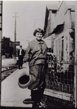 "Lady is a Hyatt, in front where Callahan's Grocery was before the town burned in early 1930's."
