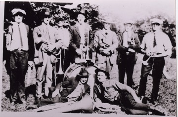 Men posed for a group portrait with their instruments. 