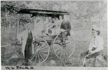 Includes M. W. Gamble, attorney in Moorefield.  Taken at picnic during a riding tournament.