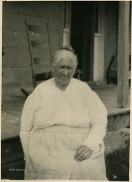 From "Beckley U.S.A." by Harlow Warren, p. 406, vol. 2. "The wife of Clarkson Prince at their home in Beaver."