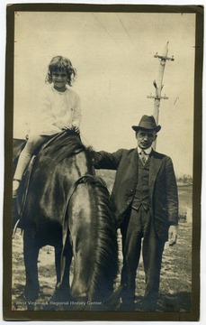 From "Beckley U.S.A." by Harlow Warren, p. 777, vol. 3. On back of portrait: " Dr. Cox, Elkhorn Piney M. Co. Stanaford Gertrude Reese (4-5) a mine foreman's daughter." In book: "The most important horse is the one used by the local physicians, for instance, the well-known company doctor, Dr. Cox, Elkhorn Piney Mining Company; Gertrude Reese, 4, on board" (p. 777).