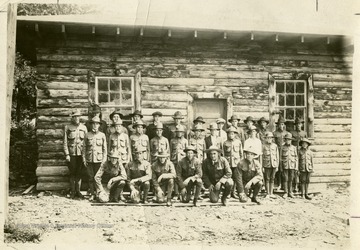 From "Beckley U.S.A." by Harlow Warren, p. 77, vol. 1. In book: "This is purported to be the first organized Boy Scout troop in Raleigh County; there was a No. 1 at East Raleigh, but it surrendered its charter and joined the above. It was sponsored by Raleigh Mining Institute; its prime mover was Col. Ernest Chilson and Scout Master, R. B. Holmes, of 308 Temple Street, Beckley. Mr. Holmes led the troop for ten years. The cabin was handsomely built by R. M. I. on the hill back of the coal company store, and still exists-unused and deteriorating!" (p. 77). Back of portrait: "Boy Scouts and cabin. Col. Chilson sponsor, prime mover and inspiration, Raleigh Troop No. 2; combine of 1 and 2. R. B. Holmes Scout Master ten years, sponsored by Raleigh Mining Institute. Back of new store. R. B. Holmes, electrical engineer." Harlow Warren, copyright 1955.