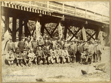 The forty men are unidentified, but all are dressed up in suits with vests and hats.