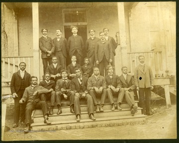 Group photo of Storer College YMCA Group taken on front steps and porch of building. Pres. McDonald in back row.