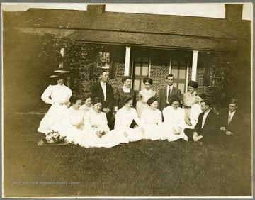 Group portrait. R.C. Spangler back row 2nd from right, kneeling.