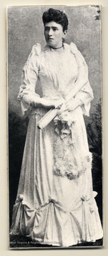 From April 1936 Alumni Magazine. Harriet Eliza Lyon, a transfer student from Vassar College was WVU's first woman graduate. The only woman in the fourteen member Class of 1891, she won the honor of being valedictorian. Born in Fedonia, New York, she moved to Morgantown with her family in 1867 when her father, Franklin Smith Lyon, accepted a position as one of WVU's first professors. After graduating from the University, Harriet Lyon returned to Fredonia and married Franklin Jewett, a professor of science at the Fredonia Normal school. She raised four children and was active as a musician, singer, composer, and community leader. Harriet Lyon was a grandniece of Mary Lyon, the founder of Mt. Holyoke College.