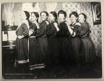 The Spinster Club in Gym Suits, 1903. From left: Ruth Wood, Sallie Bennett, Willa Brand, Stella Hall, Lucy Wood, Minnie Core, Josie Kunkle. Lucy Wood left a letter which mentioned wearing her gym suit as one of six layers to keep warm in western China.
