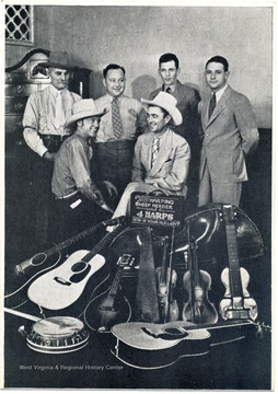 Seated left- Custer Allen; Seated right- "Cowboy Loye" Pack; Standing left to right: James "Sheepherder" Moore, "Silver Yodlin" Bill Jones, "Curley" French Mitchell, "Just Plain John" Oldham. Performed at WWVA Wheeling or WMMN Fairmont.