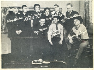 Front Row, Left to Right: Ray Myers, Just Plain John, Cowboy Loye; Back Row, Left to Right: Sheep Herder, Curley Mitchell, Radio Dot, Betty, Jake Taylor, Custer Allen.