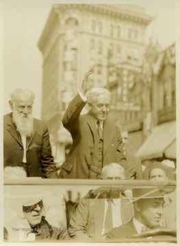 John W. Davis riding through streets of Clarksburg with John C. Johnson (bearded) of Bridgeport.