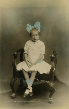 Margaret, daughter of Braxton D. and Mary M. Gibson, wearing a large hair ribbon. 