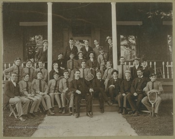 Unidentified students and staff pose in front of "The Hall" on the WVU campus.  Inscribed on the back.  "Whitesell" and "Marie Price".