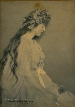 An unidentified young woman, possible a model, posing in costume. The image was created by award winning photographer, Essie Collins. This image was exhibited in several galleries world wide among these are The Royal Society in London and  The Art Institute in Chicago. See complete list filed with the original image.  