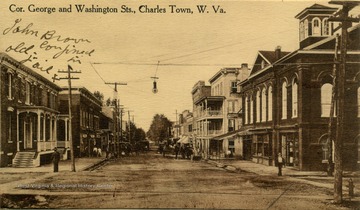 Postcard photograph of early 20th century, downtown Charles Town, Jefferson County, West Virginia. The Old Jail is shown in the left foreground where John Brown was held for trail and awaited his execution.