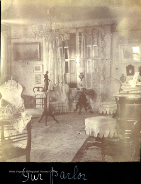 Title of photograph is "Our Parlor". The original is displayed in Frances Packette Todd's photograph album. 