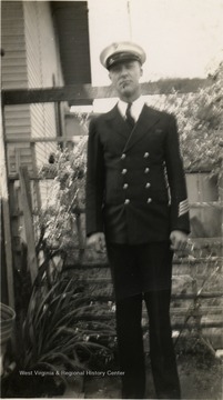 Clifford Kain Condon, dressed in naval uniform. the photograph was taken  before World War II. Condon was captured near Manila by the Japanese in December, 1941 and later died in a POW Camp.
