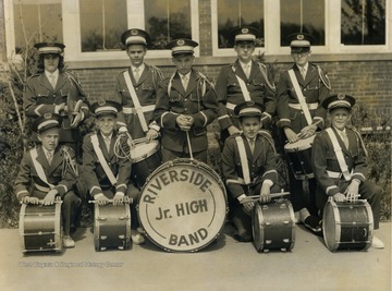 Group portrait of the drum section in full uniform.