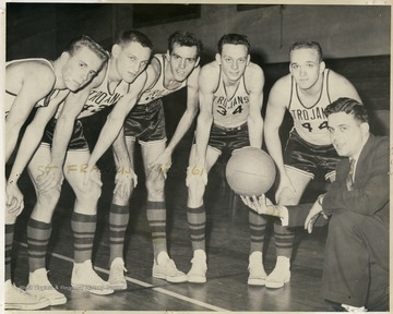 Group portrait of unidentified members of the Trojans' team.