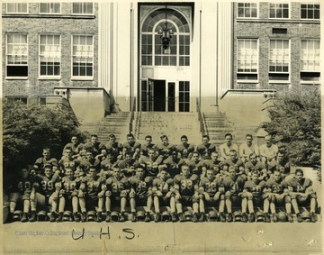 Portrait of the UHS Hawks Football Team, photograph taken on the front steps of the old school in Morgantown.