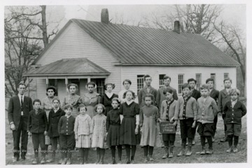 First row, left to right: Joe Chipps, Teacher; George Hewitt, Ernest Light, Robert Henry, Neva Henry, Ruth Williams, Beulah Brand, Mabel Snider, Rex Williams, Ray Williams, Reece Henry, Stanley Henry. Second row, left to right: May Scott, Stella Scott, Ira Brand, Gail Brand, Sylvia Brand, Dana Snider, John Cole, Charles Loar, Earl Scott, Charles Jamison.