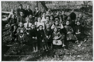 First Row left to right: Blanch Cole, Virginia Sanders, Esther Cole, Mary Cordray. Second Row left to right: Earl Tucker, Gladys Barnhart, Emma Henderson, Winnie Cordray, Lenna Core, Cecil Riley, Jessie Core, Rose Core, Mamie Cole, Nora Henderson. Third Row left to right: Blanch Ramsey, Greek Riley (teacher) Mamie Cordray, Ezora Hoffman, Jesse Fox, Bill Core, Harold Berry, Ralph Berry. Fourth Row left to right: Earl Core, Eldon Tucker, Bart Core, Wyland Tucker, Lorentz Berry.