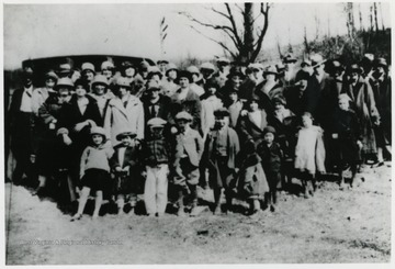 Sunday School Picnic,Front row, the child turning back Josephine Kelly. Beside her is Howard Kelly and next to him is Eugene Lewis. In the second row, the girl with the coat open is Rose Ellen Lewis. Next to her is Florence Lewis Godfrey, then Mildred Kelly. Toward the Center, tall lady with the black hat is Damaris Lewis. Beside her, the short lady with a black necktie is Lizzette S. Lewis. Beside her is the class teacher,Mrs. Vandervort.