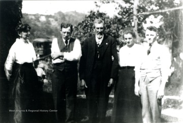 Left to Right: Nancy Jane, William, Francis M., Germaine, and John Sr. Photograph taken at Francis M. Ashcraft's home. Note the electric street car in the background at the end of the Clarksburg to Reynoldsville run. 