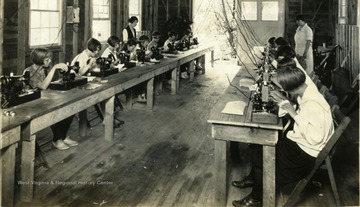 The girls were taught to use the electric sewing machines. 