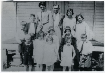 Last day of school. Back row: William Haun, Raplph Williams, Homer Miller, Teacher, E.G. Rice, Beulah Williams, Mildred Kelly. Middle row: Mary Kelly and Betty Williams. Front row: Norval Williams, Irene Miller, Marie Satterfield, Juanita Miller, Lee Haun.