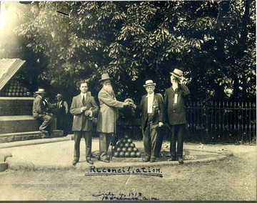 Brown Price and unidentified others pose at the High Water Mark on the battlefield at Gettysburg, Pennsylvania. The monument marks the farthest point of advance for the Confederate Army during Pickett's Charge, before being repulsed by the Federal troops on Cemetery Ridge.