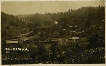 Post card print of a wide angle view of Tunnelton. Inscription on the back, "Sat Aug 14/1908 Going home, Calvin Smith" 