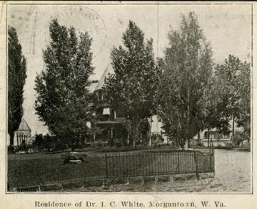 Post card print of Dr. I. C. White's home. There is a long note on the back to "Mother" from "MHS". See original for context of the note.