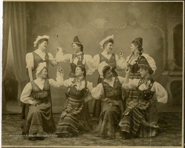 Possibly a group of folk dancers posing in eastern European style dress.