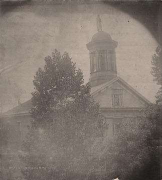 Note the statue of Patrick Henry on top of the Court House; also an unidentified man is seen on the left side of the roof.