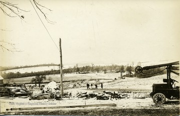 Several men digging and preparing for excavation and well drilling in Arthurdale, West Virginia.