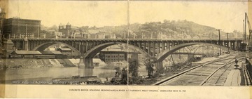 Concrete bridge spanning Monongahela River and several railroad tracks at Fairmont, West Virginia. Dedicated May 30, 1921.