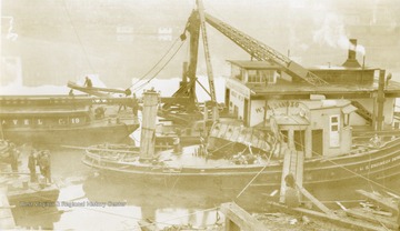Damaged towboat, part of the United States Engineering Department, after wrecking. Towboat built by The Charles Ward Engineering Works in Charleston, West Virginia.